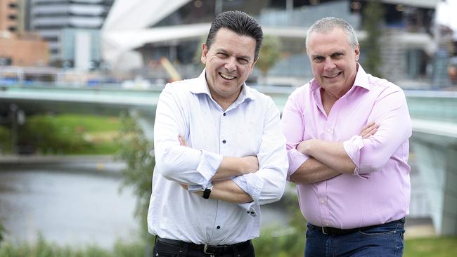 Senator Nick Xenophon with his campaign director and NXT candidate Stirling Griff, at the Adelaide Oval footbridge. Picture: Bianca De Marchi