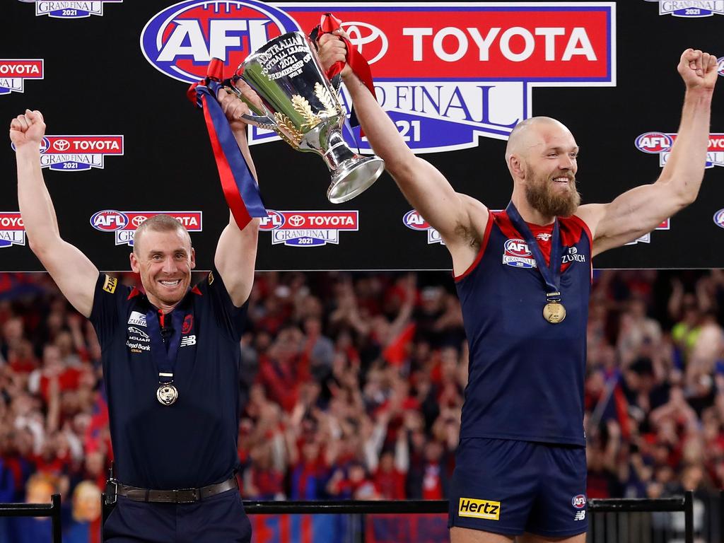 Melbourne coach Simon Goodwin and his captain Max Gawn hold the premiership cup aloft after winning the 2021 AFL grand final. Picture: Michael Willson/Getty Images