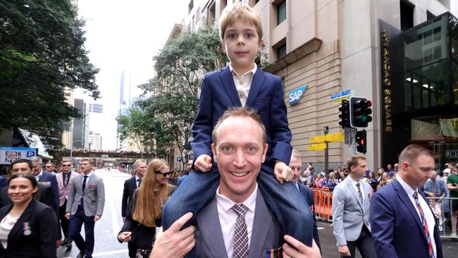 MAJ Andrew Pengaligon, Battery Commander 133rd Battery, 20 Regiment, RAA, with son Joshua Penhaligon, during the Anzac Day Parade. Photo: Steve Pohlner