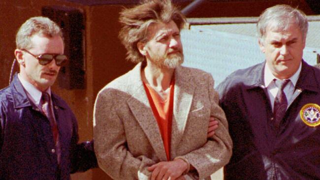 USA Unabomber suspect Theodore (Ted) Kaczynski (c) being escorted from courthouse by use federal agents 04 Apr 1996. bomb explosion bombing