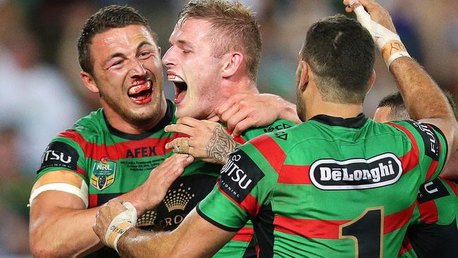 Sam Burgess celebrates brother George’s try in the 2014 grand final. Photo: Gregg Porteous