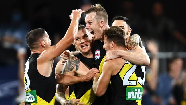 Richmond forward Jack Riewoldt is mobbed by teammates after kicking a goal during the Grand Final against Geelong. Picture: Getty Images