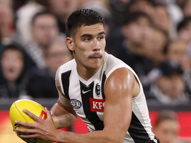 MELBOURNE, AUSTRALIA - MARCH 21: Reef McInnes of the Magpies runs with the ball during the round two AFL match between St Kilda Saints and Collingwood Magpies at Melbourne Cricket Ground, on March 21, 2024, in Melbourne, Australia. (Photo by Darrian Traynor/Getty Images)