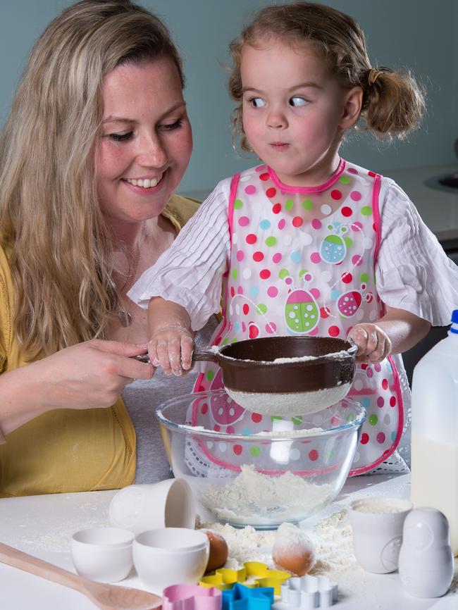 Millie Esler, 4,  helping her Mum, Natalie. Picture: Jay Town