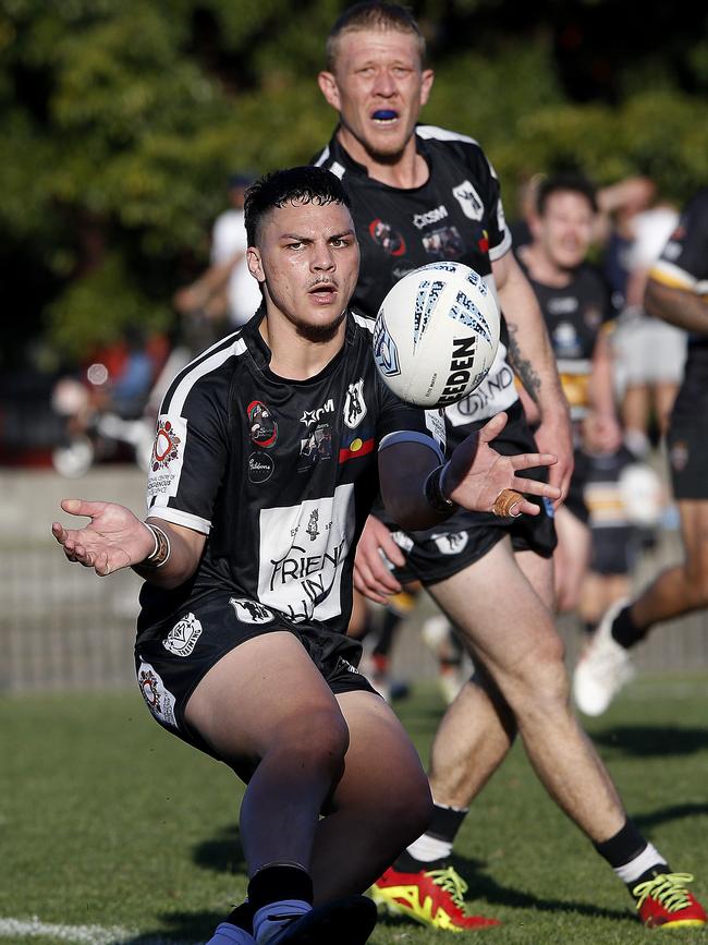 Redfern's James Frazer passes the ball. Picture: John Appleyard