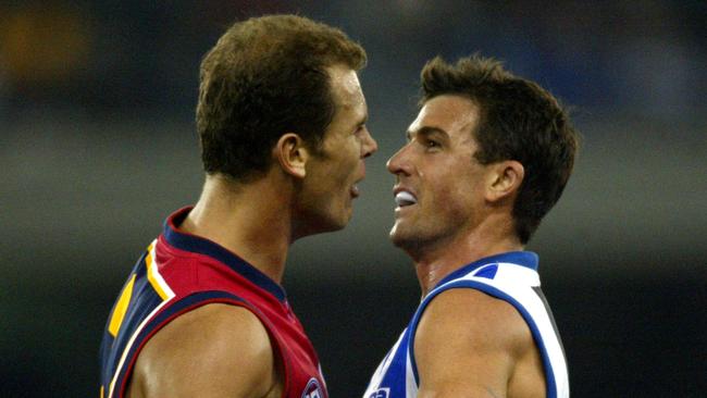 Carey and Stevens clash during North Melbourne Kangaroos v Adelaide Crows at the Telstra Dome in Melbourne, May, 2003. Photo: George Salpigtidis.