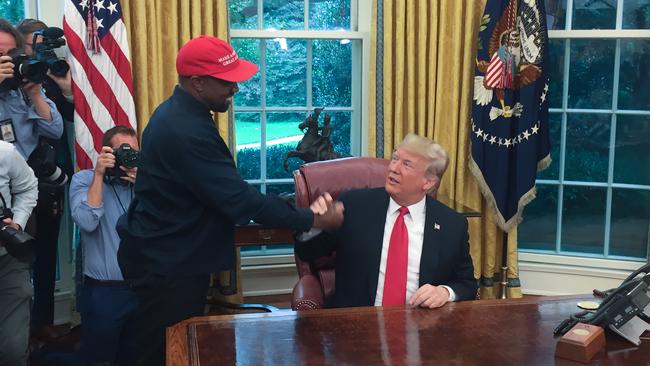 US President Donald Trump meets with rapper Kanye West in the Oval Office of the White House in Washington, on October 11. Picture: AFP