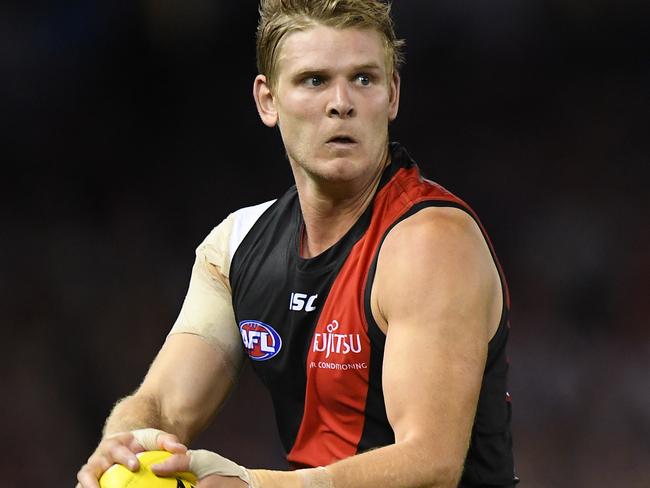 Michael Hurley of the Bombers is seen in action during the Round 1 AFL match between the Essendon Bombers and the Adelaide Crows at Etihad Stadium in Melbourne, Friday, March 23, 2018. (AAP Image/Julian Smith) NO ARCHIVING, EDITORIAL USE ONLY