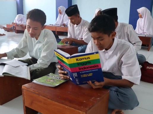 Students of Madrasah Aliyah (islamic boarding school) in Tanjung District of North Lombok in their rebuilt classroom following its collapse by an earthquake last year. Picture. Lukman S. Bintoro