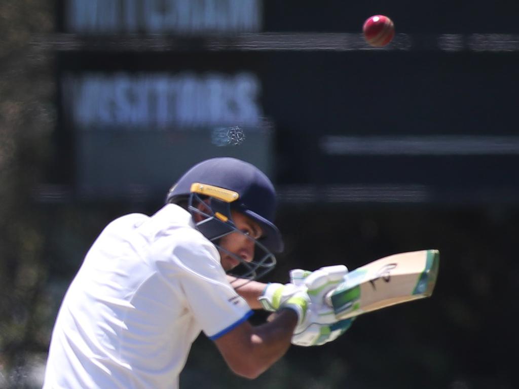 Grade Cricket match between Sturt and Kensington at Price Memorial Oval, Hawthorn. Sturt's Brinder Phagura ducks under a ball from Nicholas Palmer. 3 November 2018. (AAP Image/Dean Martin)