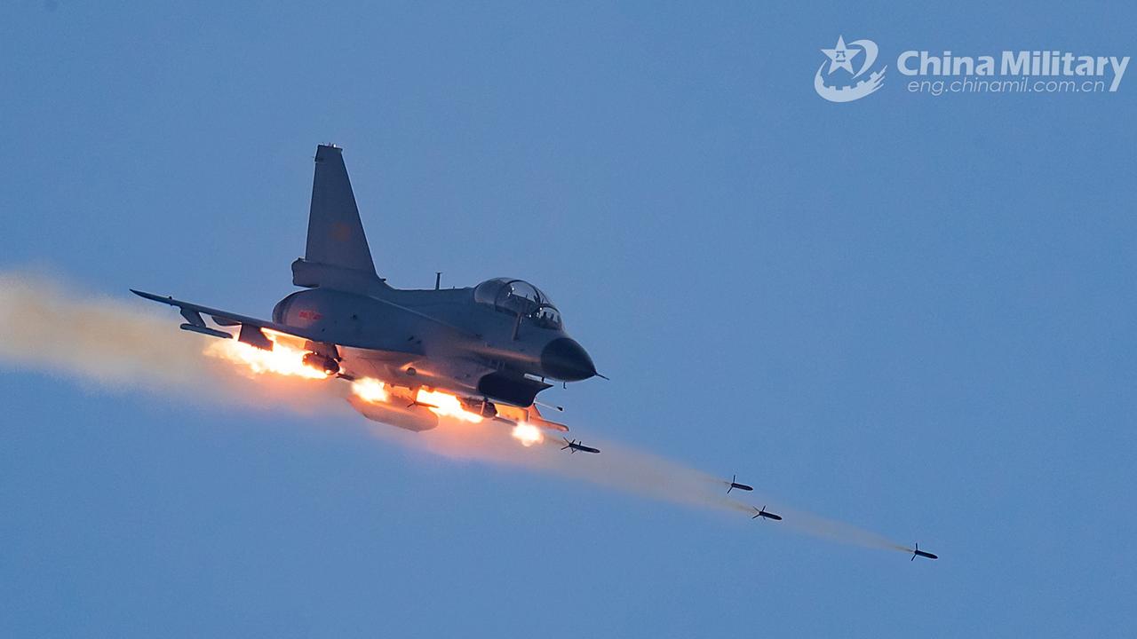 A J-10 fighter jet attached to an aviation brigade of the air force fires rockets at mock ground targets while taking a nosedive during a recent penetration flight training exercise. Picture: PLA