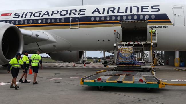 The vaccines being loaded off the plane. Picture: NCA NewsWire / Gaye Gerard