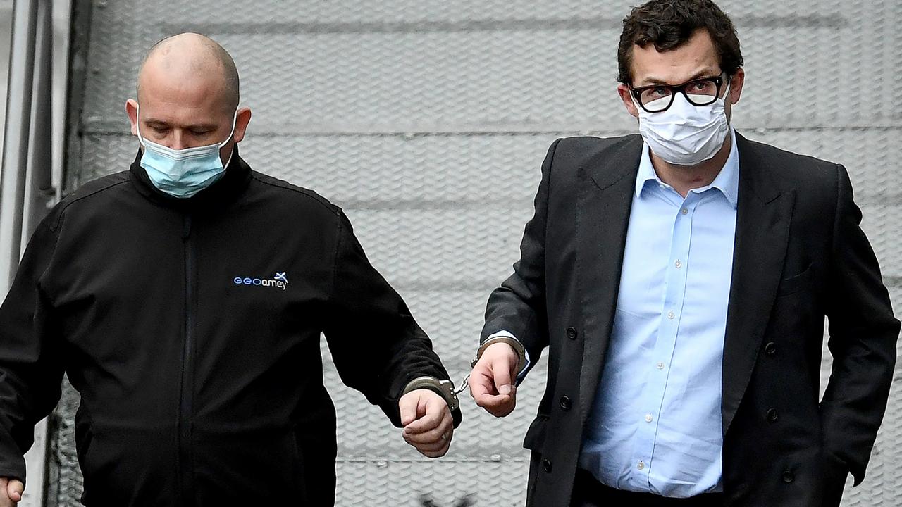 Simon Bowes-Lyon, the Earl of Strathmore (right) leaves court in handcuffs after being sentenced to jail for 10 months for sexually assaulting a woman. Picture: Jeff J Mitchell/Gett