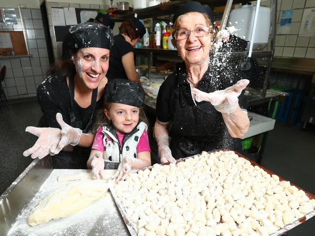 Pasta making classes are among the events on offer during the new-look Adelaide Italian Festival. Giuditta Hooper and Stella, 4, with Maria Calvarese making gnocchi. Pic Tait Schmaal.