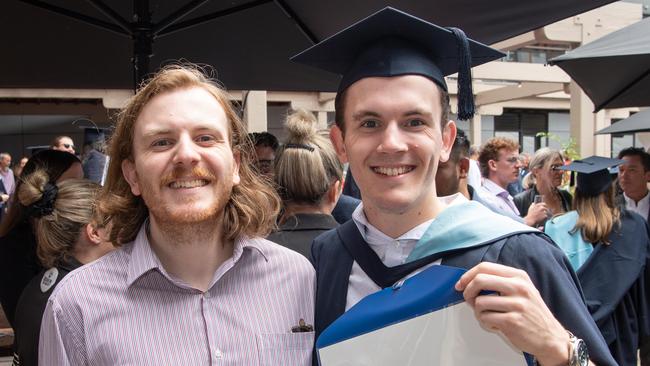 Ben and Tom White celebrate graduation. Picture: Brad Fleet