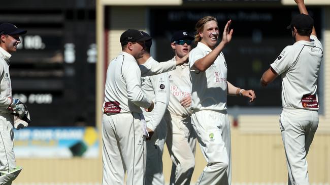 Will Sutherland celebrates a wicket with his Prahran teammates last season. Picture: Mark Dadswell