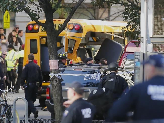 A smashed school bus at the scene of a terrifying vehicle attack in New York that killed at least eight people. Picture: AP