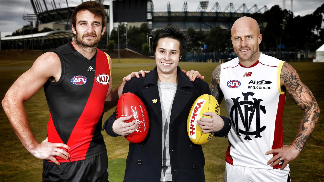 Essendon captain Jobe Watson and Melbourne skipper Nathan Jones with 19 year old cancer survivor Liam Evans before this weekends 10 year annversay of the Adam Ramanaskus cancer mach at the MCG. Pic: Michael Klein