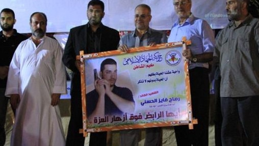 In 2012, Fayez Elhasani attended a memorial ceremony for his son Remah, who was a member of the Palestinian Islamic Jihad.