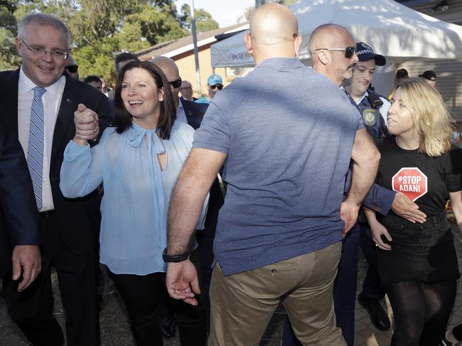 Prime Minister Scott Morrison and wife Jenny accosted by an anti-Adani coal mining protester at LilliPilli Public School. Picture: Rick Rycroft