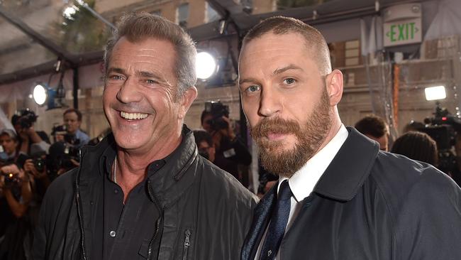 2015: Mel Gibson and Tom Hardy at the Hollywood premiere of Mad Max: Fury Road. Picture: Kevin Winter/Getty Images