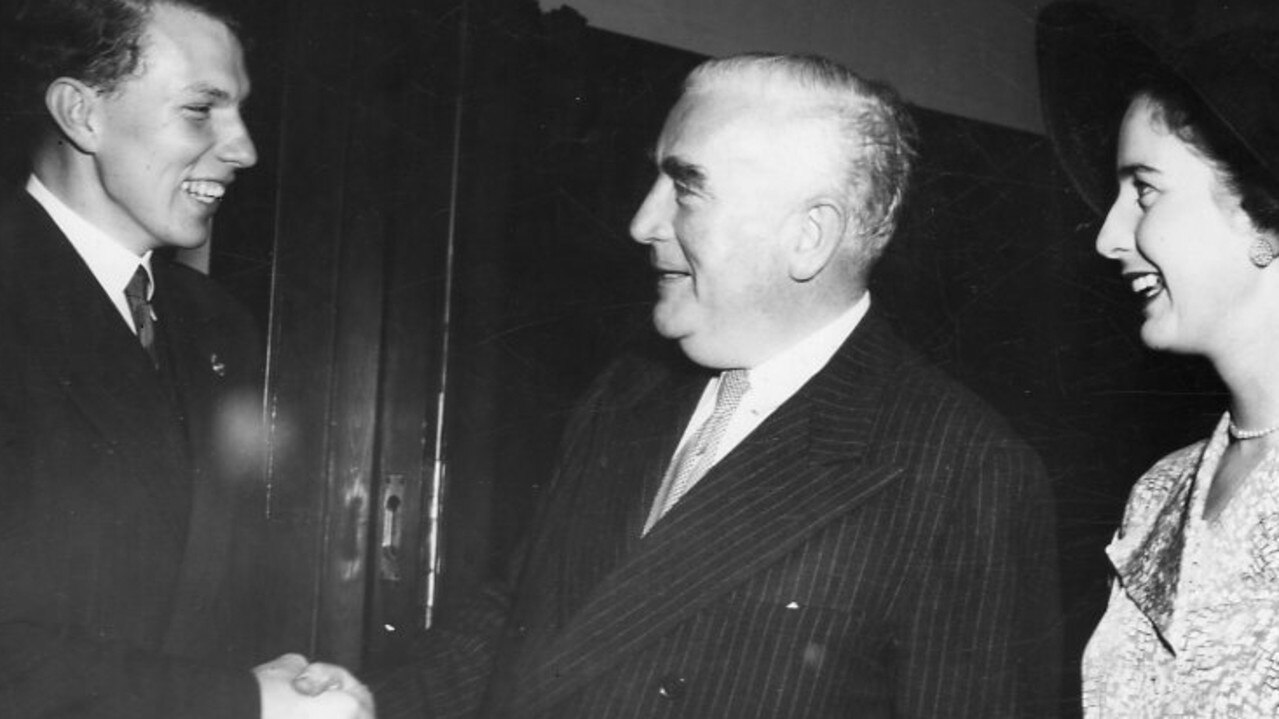 Prime Minister Robert Menzies (centre) shaking hands with Ian Wilson (left) on his “Meet The People” tour in South Australia in 1953. His daughter Heather Menzies is on the right. Picture: Dick Joyner/News Corp Australia