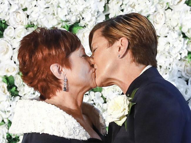 A supplied image obtained Friday, February 2, 2018 of Christine Forster (right) and Virginia Edwards during their wedding ceremony in Sydney, Friday, February 2, 2018. (AAP Image/Supplied by @inlightenphotograhy) NO ARCHIVING, EDITORIAL USE ONLY, MANDATORY CREDIT