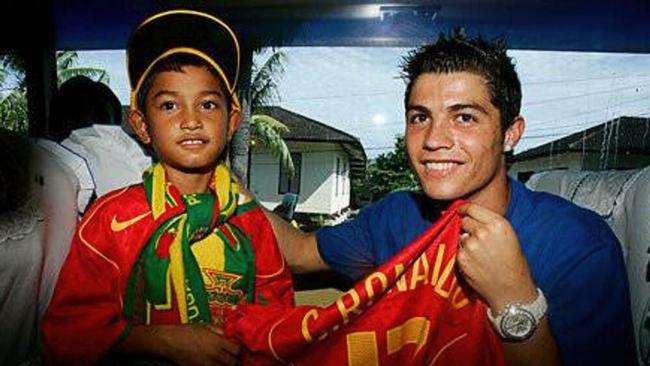 The lost boy of Banda Aceh, Martunis, with Cristiano Ronaldo