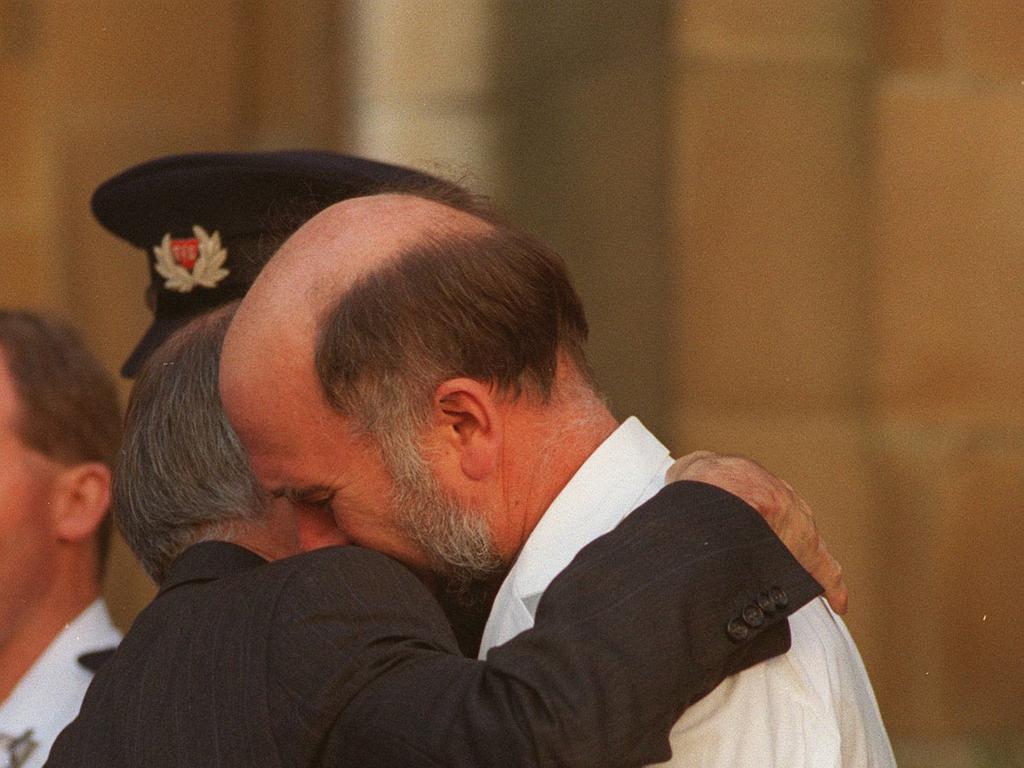 Dr Bryan Walpole hugs then PM John Howard.