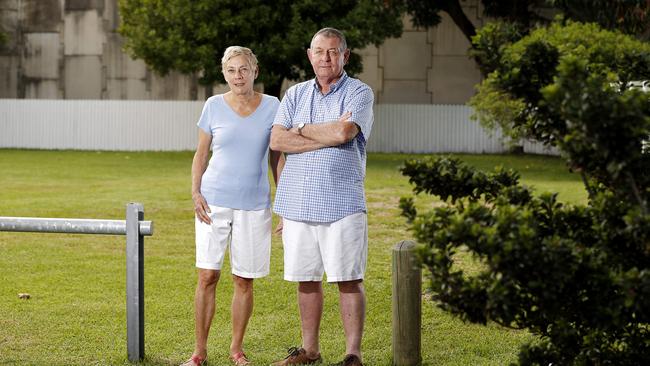 Ellen-May Maddern and Peter Maddern posing at their old property in Clayfield, Brisbane 10th of April 2019. Their home was repeatedly flooded after the Airport Link was built. Picture: AAP/Josh Woning