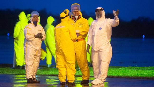 Soldiers at the Air Force base of Anapolis, Brazil, prepare to sterilise a plane used to fly Brazilian citizens from the coronavirus zone in Wuhan, China. Picture: Getty Images