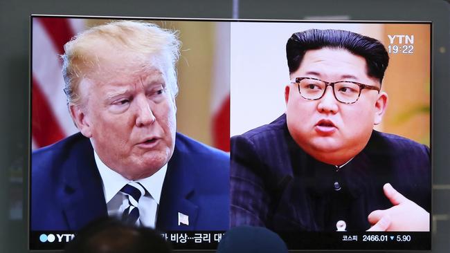 FILE - In this May 24, 2018, file photo, People watch a TV screen showing file footage of U.S. President Donald Trump, left, and North Korean leader Kim Jong Un during a news program at the Seoul Railway Station in Seoul, South Korea. Kim Yong Chol, a top lieutenant of North Korean leader Kim Jong Un is in the United States to conduct one of three sets of parallel talks aimed at salvaging a summit between Kim and President Donald Trump. (AP Photo/Ahn Young-joon, File)