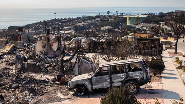 LOS ANGELES, CALIFORNIA - JANUARY 1-: Burned houses from the Palisades Fire are seen on January 10, 2025 in the Pacific Palisades neighborhood of Los Angeles, California. Multiple wildfires fueled by intense Santa Ana winds are burning across Los Angeles County. Reportedly at least 10 people have died. Over 9,000 structures have been damaged or burned while the fires have spread to more than 36,000 acres   Apu Gomes/Getty Images/AFP (Photo by Apu Gomes / GETTY IMAGES NORTH AMERICA / Getty Images via AFP)