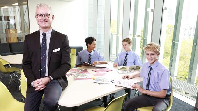 Brisbane Grammar School deputy headmaster Steve Uscinski with students Alex Thakur, Matthew Love and Hamish Moss. Picture: AAP/Claudia Baxter