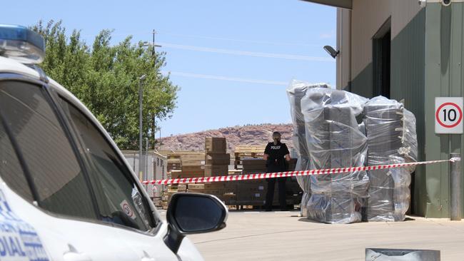 Northern Territory police at the Harvey Norman warehouse on Smith St, Alice Springs, on Tuesday February 4. Picture: Gera Kazakov