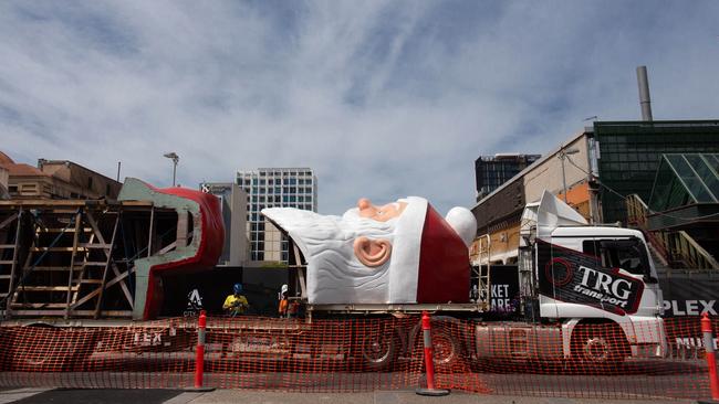 The rise of Giant Santa on Federation Hall at Adelaide Central Market. Picture: Brett Hartwig