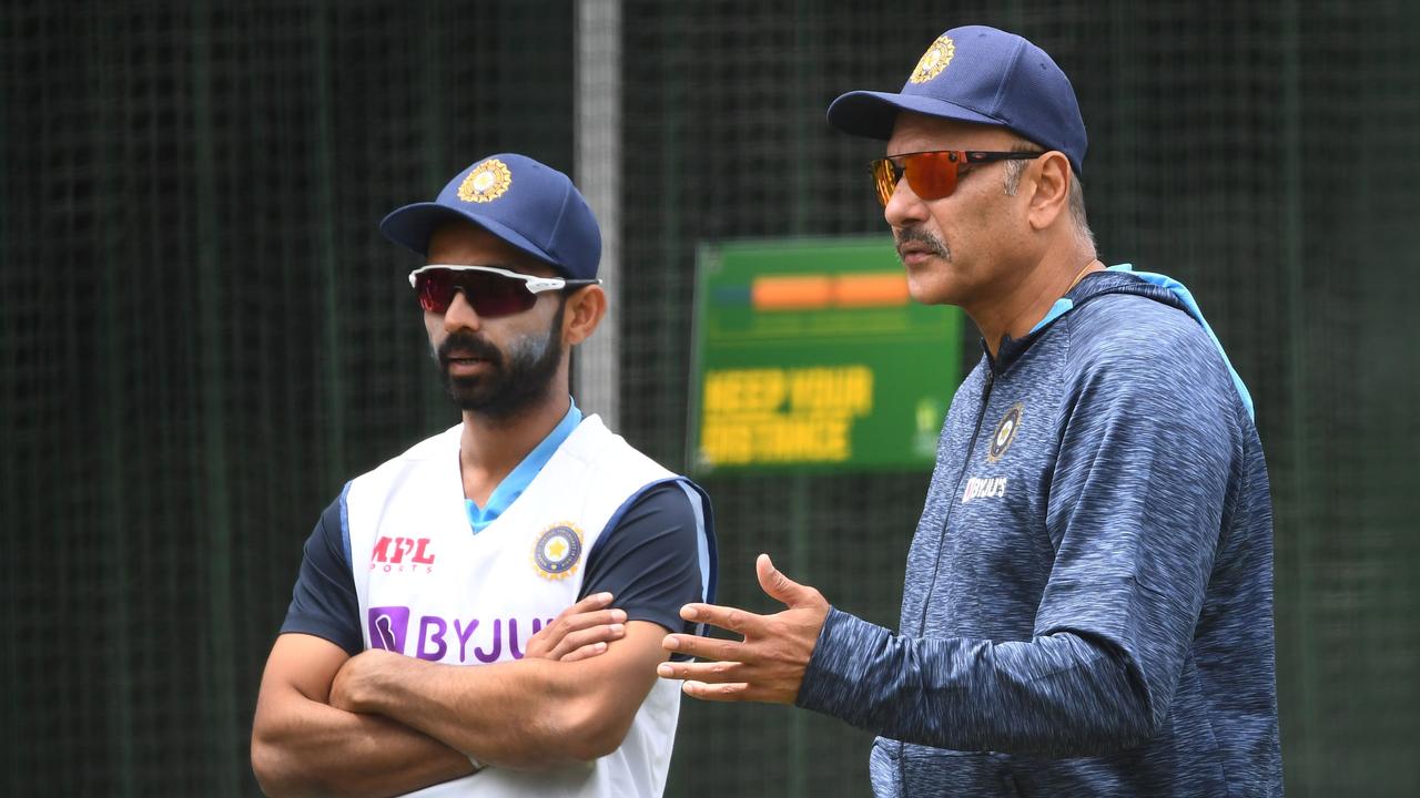 Rahane (left) talks with coach Ravi Shastri. Picture: AFP