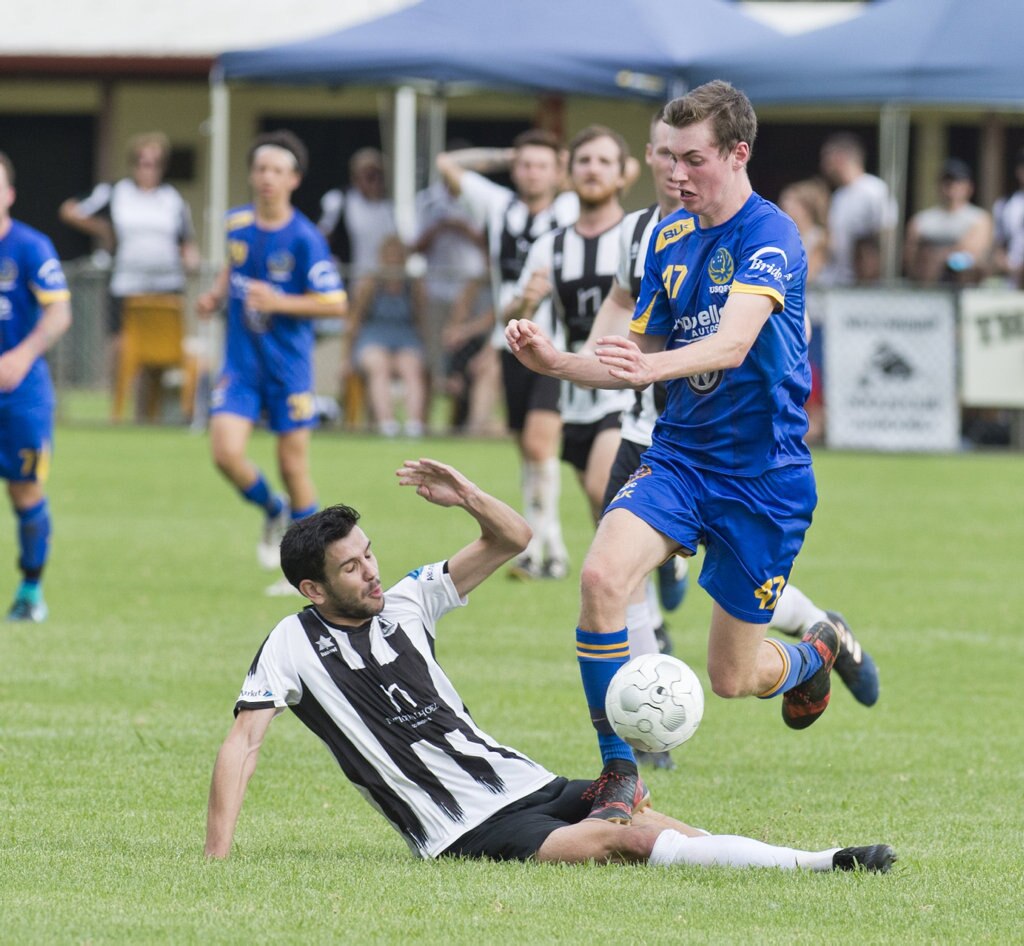 Callum Hart, Willowburn and Benjamin Adams, USQ. Football, Willowburn vs USQ. Sunday, 4th Mar, 2018. Picture: Nev Madsen