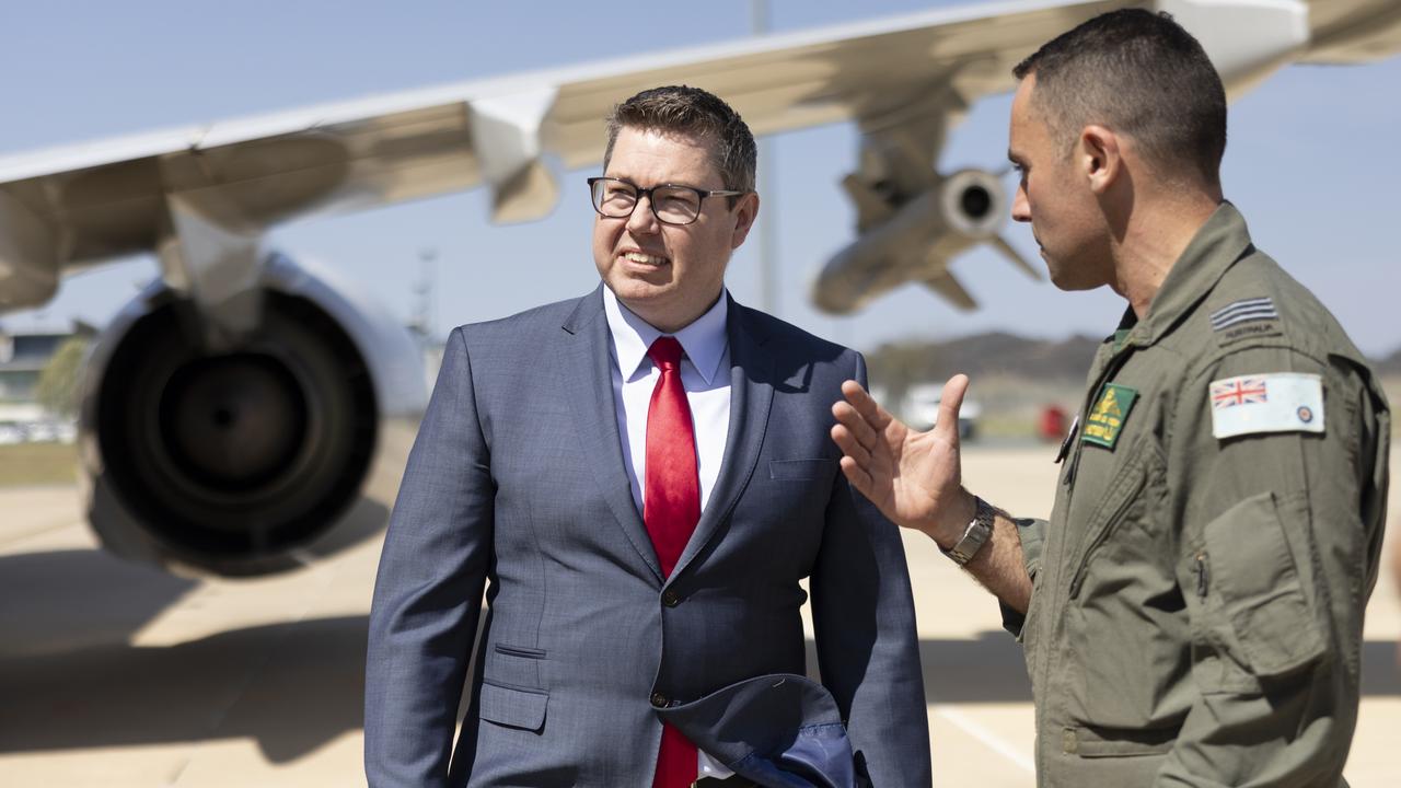 Defence Industry Minister Pat Conroy with Commanding Officer of 11 Squadron Wing Commander Adam Saber during the announcement to boost the Australian Defence Force's fleet of 14 Boeing P-8A Poseidon Maritime Patrol and Response aircraft.