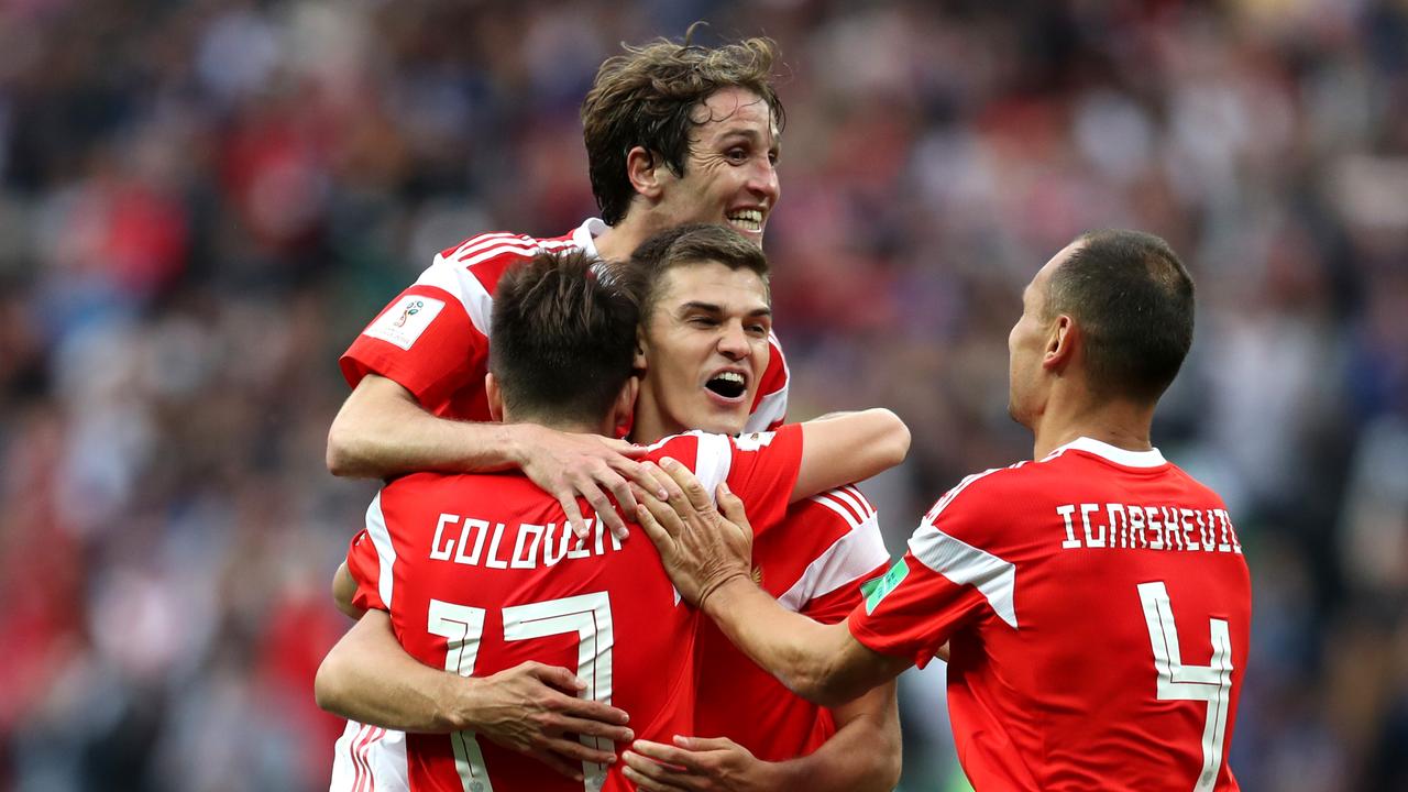 Aleksandr Golovin of Russia celebrates with team mates after scoring his team's fifth goal