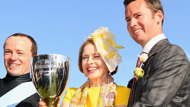 Jockey Stephen Baster (L) Trainer Gai Waterhouse and co trainer Adrian Bott pose with the trophy after winning with Pinot in race 8 the Kennedy Oaks, on 2017 Oaks Day at Flemington.