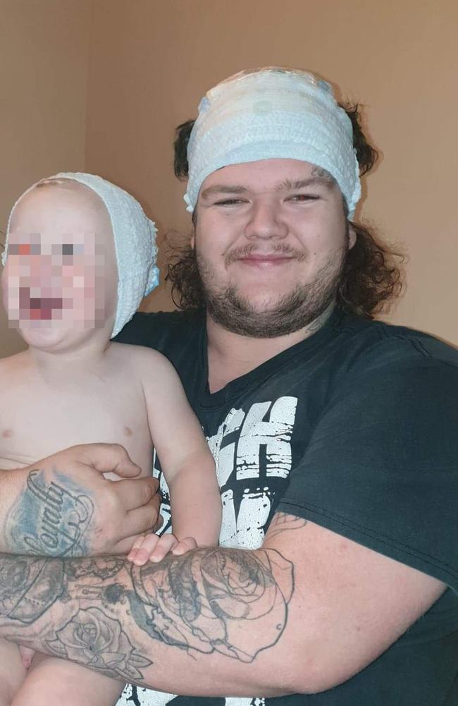 Alleged Burnie murder victim Bobby William Medcraft, 23, pictured with his young son. Picture: Facebook