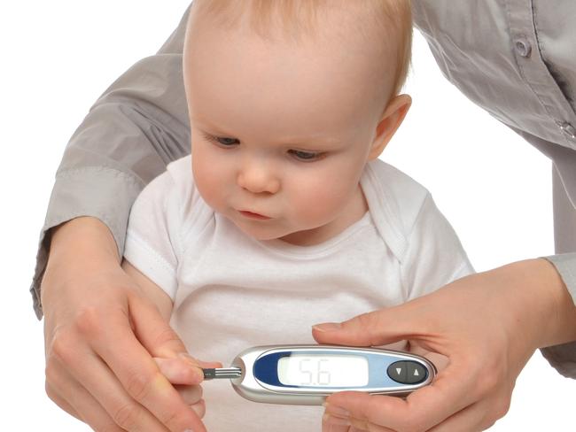 A mother measures the blood sugar level of a baby. Picture: iStock