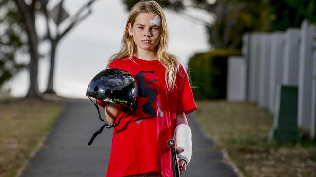 Year 7 student Chloe Uttley, fell off her scooter and smashed her growth plate in her wrist, and other injuries, but doctors says her helmet saved her life. Picture: Jerad Williams