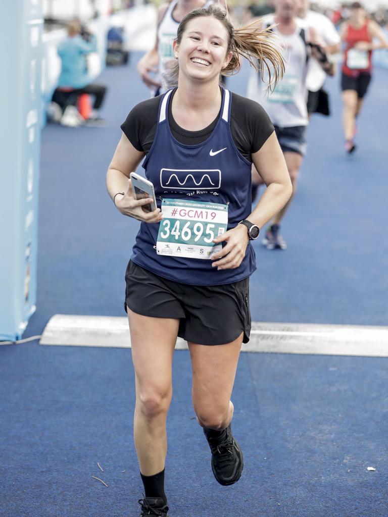 A big smile from Brooke Eacott as she crosses the finish line of the Southern Cross University ten kilometre Run. Picture: Tim Marsden.