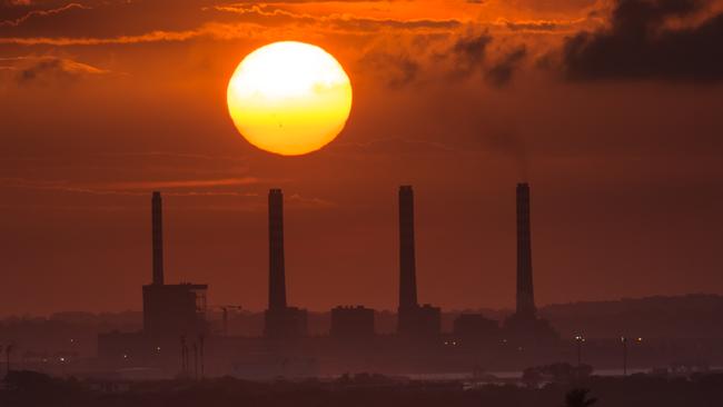 The sun sets over El Palito oil refinery in Puerto Cabello, Venezuela. The 2018 economic for the country is ever-darker. Picture: Meridith Kohut/Bloomberg