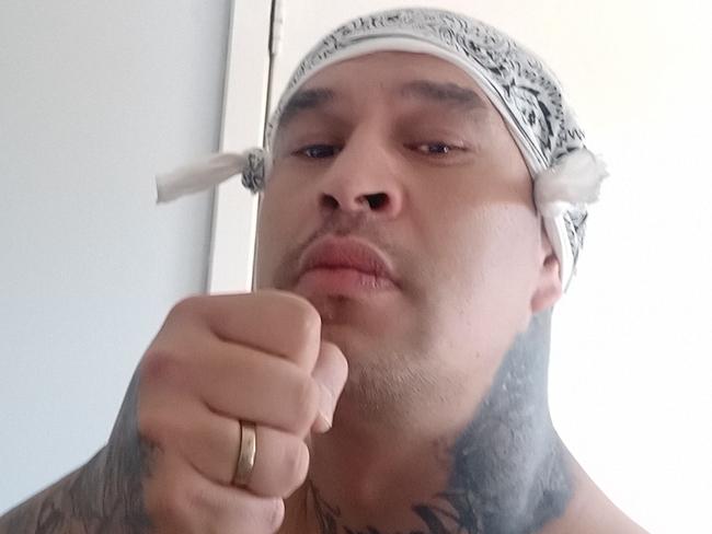 Terrance Walker, 38, posed as a 'bikie hitman' to extort money from an acquaintance's parents over a $100 debt.