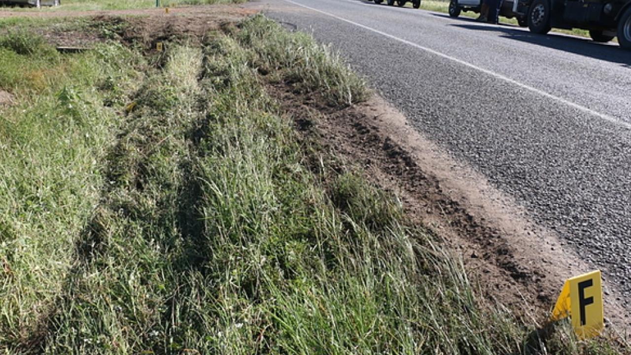 Tyre marks leading up to dirt driveway the bus struck.