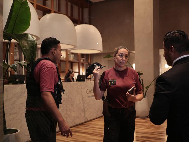 Hotel staff talk in the lobby in the aftermath of the tragedy. Witnesses said Payne kept appearing in the lobby looking agitated in the minutes leading to his death. Picture: Getty Images.