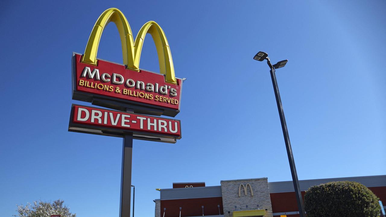 McDonald’s lays off hundreds, cuts pay